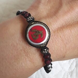 TIBETAN RED AND GOLD OM SYMBOL BRACELET